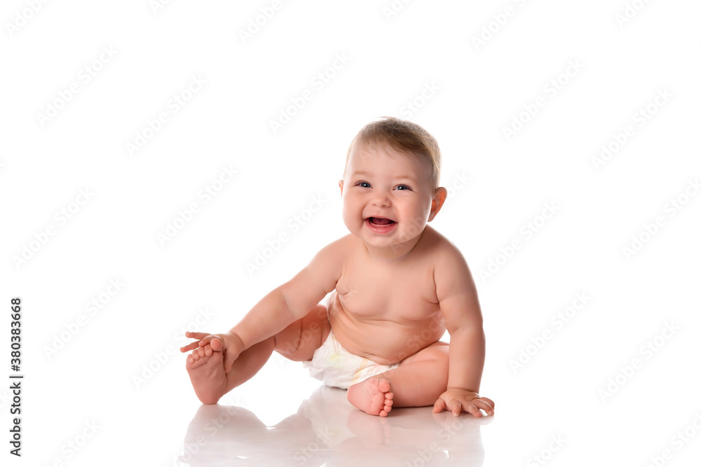 Happy smiling baby on floor over white background Happy smiling baby on floor over white background