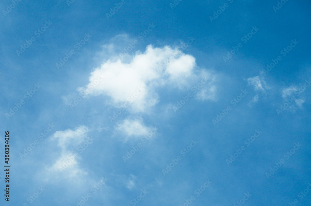 Obraz premium Blue sky with white cloud. The summer heaven is colorful clearing day Good weather and beautiful nature in the morning.