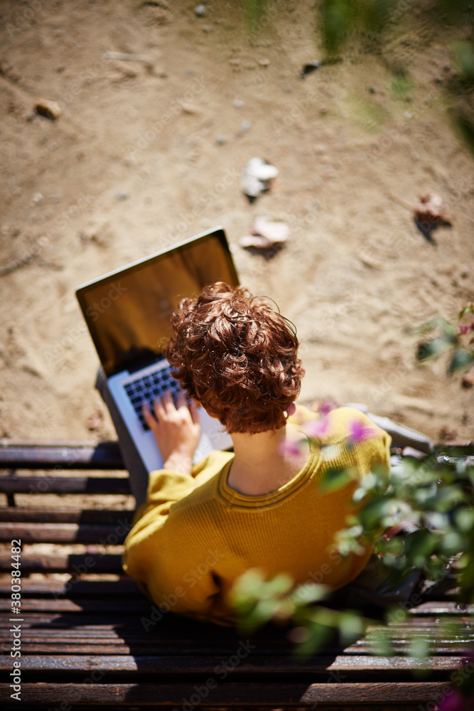 Young woman writing in a computer Young woman writing in a computer