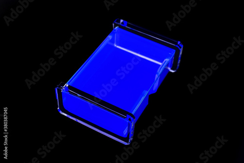 blue neon plastic box on black background © Roberto Sorin