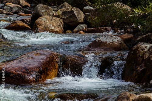 in summer rocky mountain river water silk. mountain river