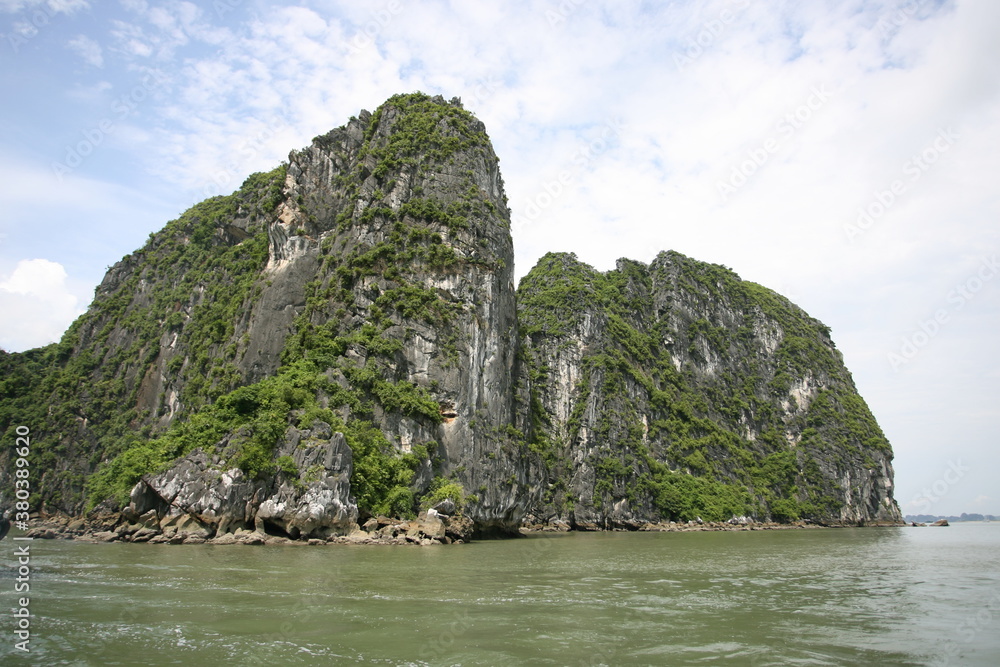 Tourist junks floating among limestone rocks at early morning in Ha Long Bay, South China Sea, Vietnam, Southeast Asia. Five images panorama