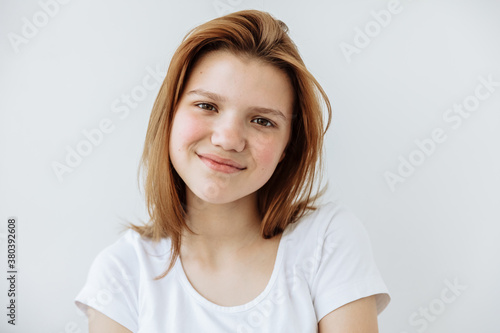 Shady Teen girl posing against white background