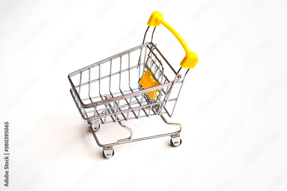 Toy grocery cart on a white background Toy grocery cart on a white background