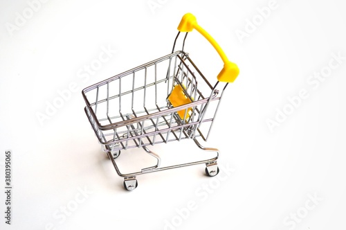 Toy grocery cart on a white background