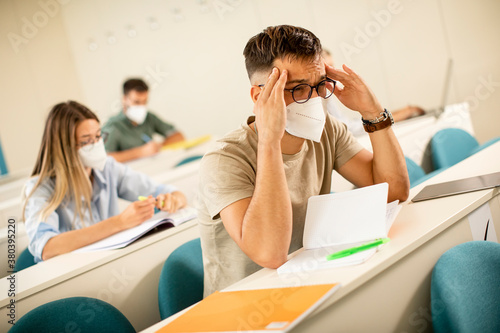 Male student wearing face p...
