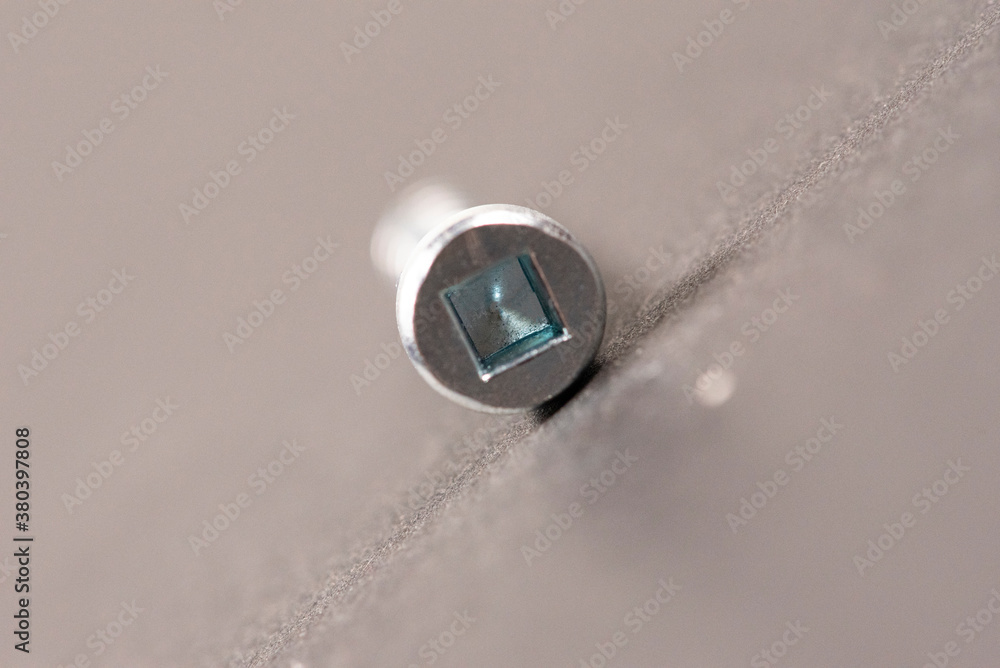 square fixing screws on white background. Macro square fixing screws on white background. Macro
