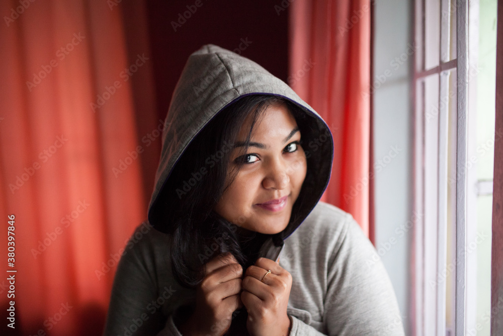 Beautiful girl in sweatshirt looking at camera and smiling,winter portrait Beautiful girl in sweatshirt looking at camera and smiling,winter portrait