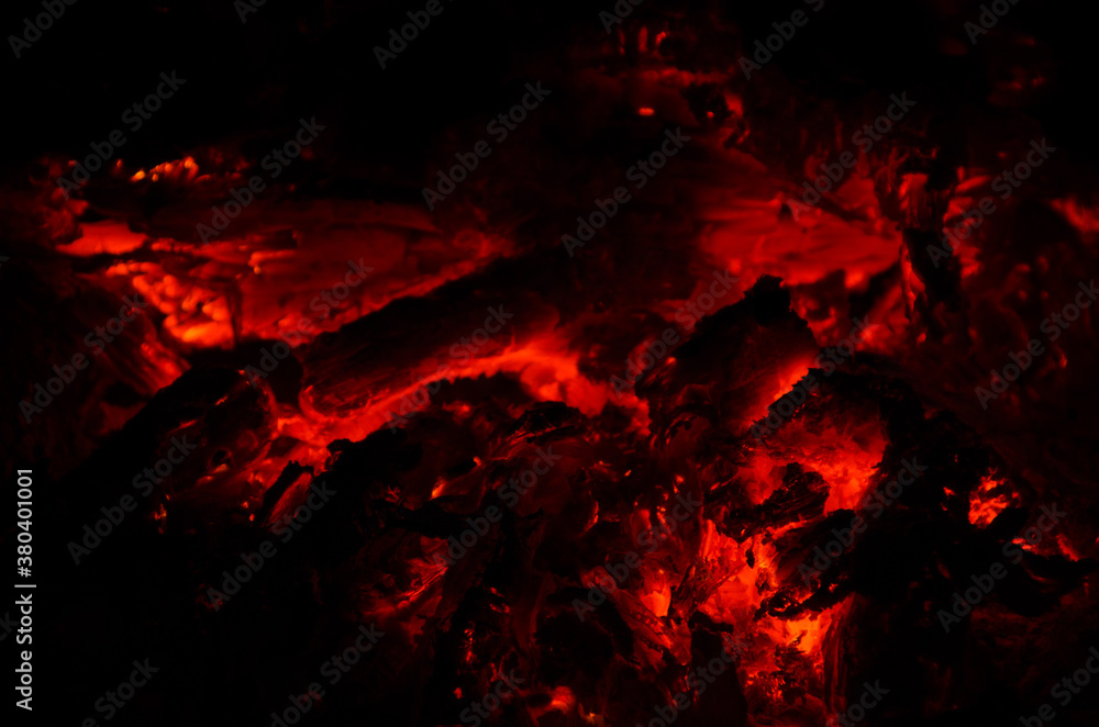 Fototapeta premium embers burn down in a hardwood fire