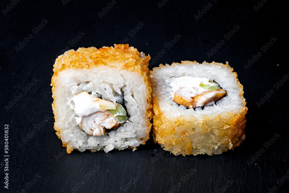 sushi rolls on a black background sushi rolls on a black background