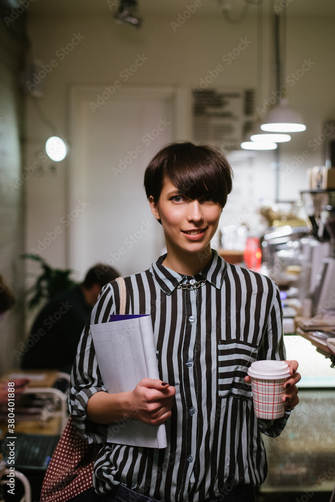 Portrait of a young stylish woman in a coffee shop Portrait of a young stylish woman in a coffee shop