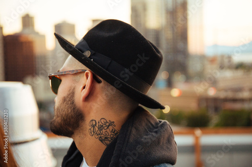 Tattooed man in the city. photo