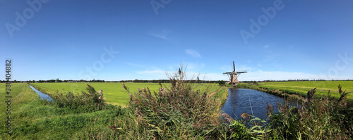 Frisian landscape panorama with windmill