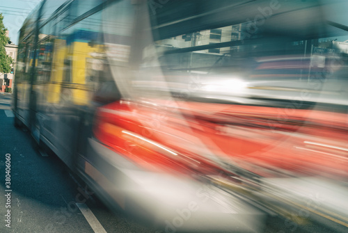 A blurred bus passing by.
