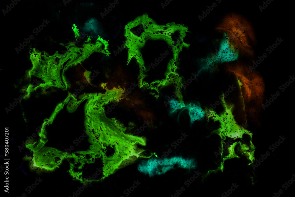 Ink flowing and mixing with colored powder Ink flowing and mixing with colored powder