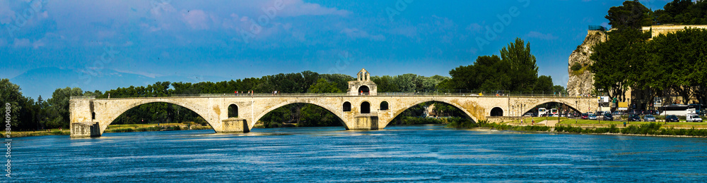Avignon, France - 6/4/2015:  Pont d'Avignon, Ruins of famous medieval bridge, with 4 arches spanning the Rhone & a small chapel to St Nicholas, Avignon, France