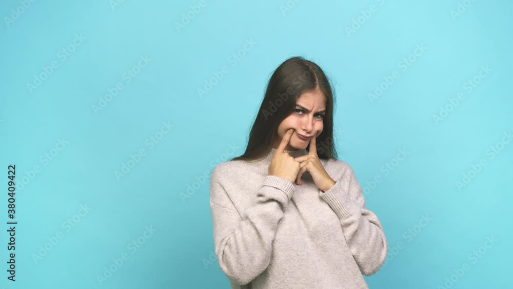 Young caucasian woman doubting between two options Young caucasian woman doubting between two options