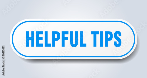 helpful tips sign. rounded isolated button. white sticker