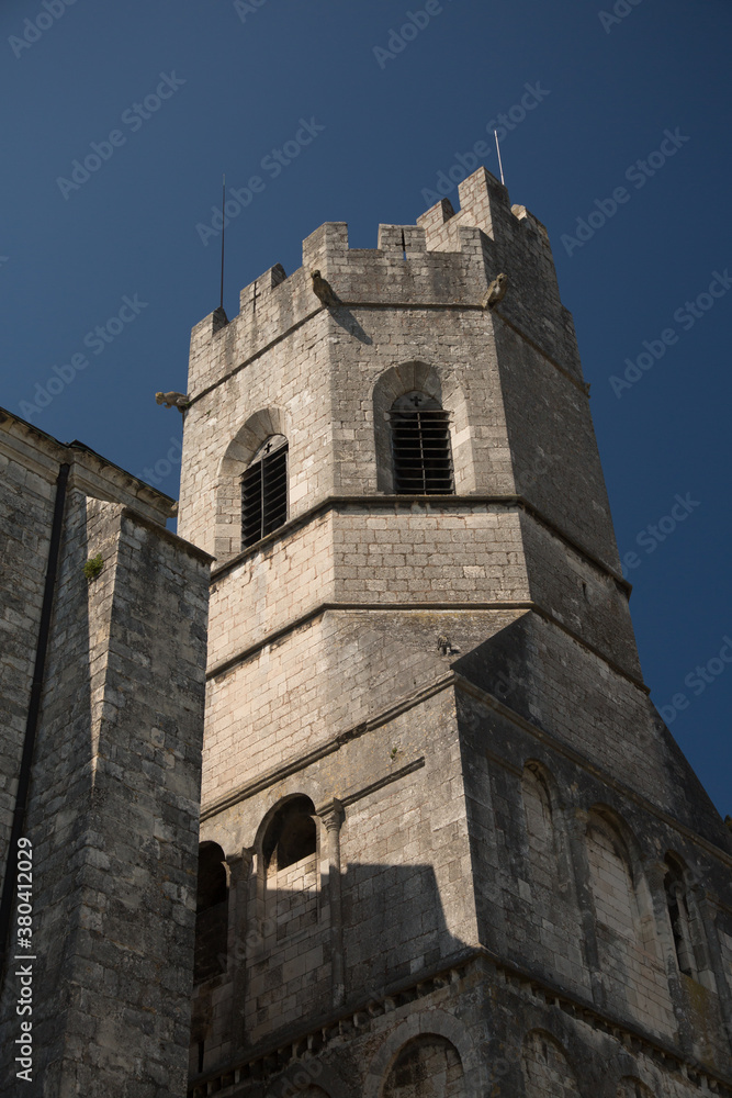 The tower of the Viviers Cathedral.  Viviers is a commune in the department of Ardèche in southern France. It is a small walled city situated on the  bank of the Rhône River.