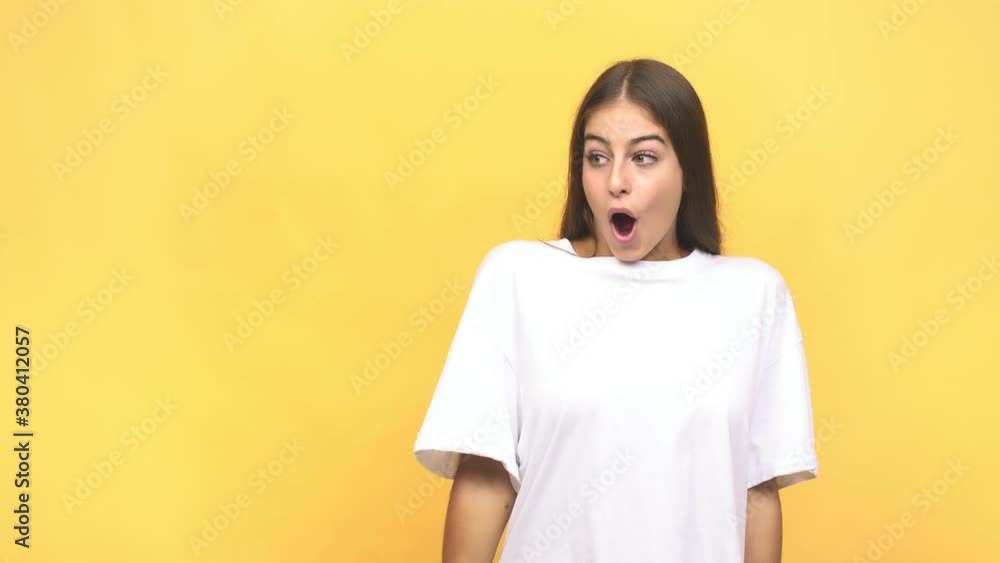 Young caucasian woman being shocked because of something she has seen Young caucasian woman being shocked because of something she has seen