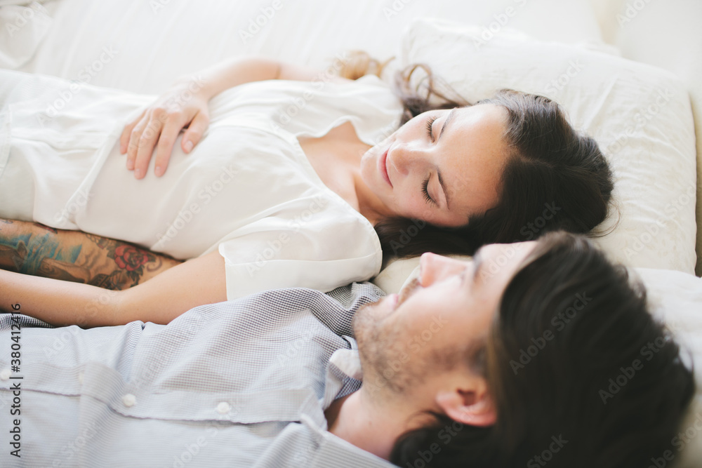 Husband and wife together in their bedroom. Husband and wife together in their bedroom.