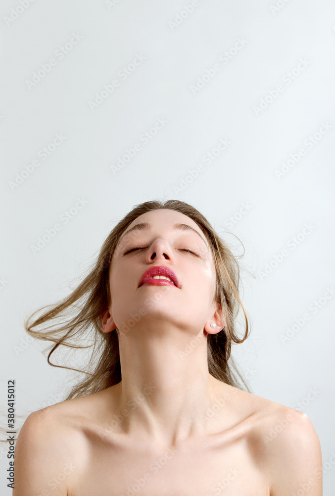 sensual woman daydreaming on white background with copyspace sensual woman daydreaming on white background with copyspace