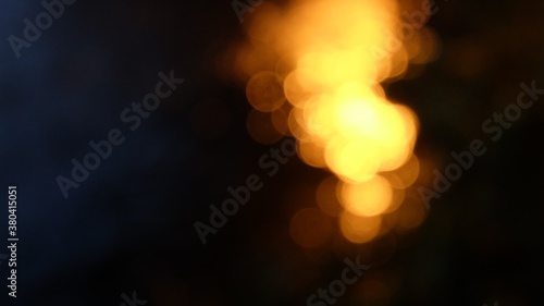 Blurred a grouop of golden light bokeh with dark background
