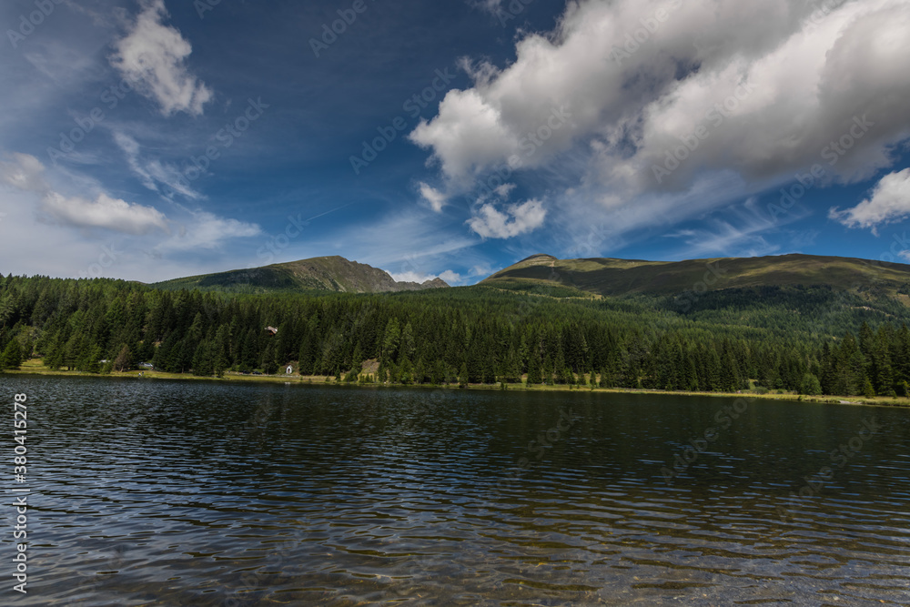 mountains trees and mountain lake while hiking