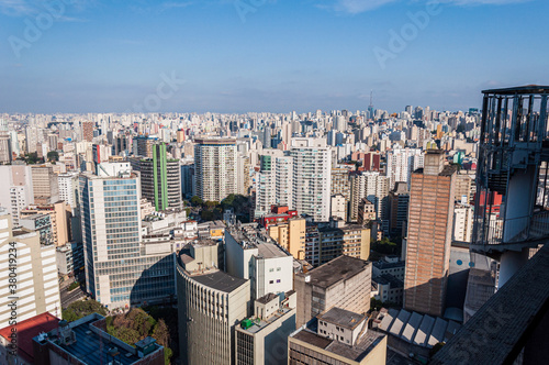 Urban aerial panorama of S  o Paulo in a sunny day with blue sky. View from Copan building.