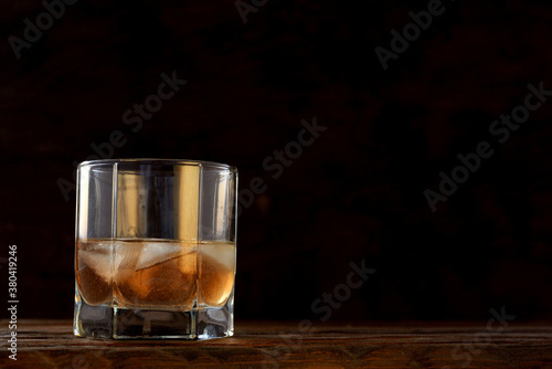 cold alcoholic drink in a glass stock on wooden table