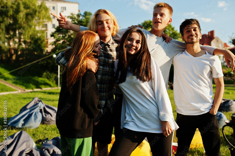 Obraz premium Young multi ethnic group of people in open air cinema.