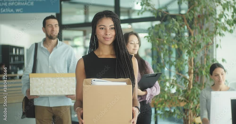 Young business people of mixed-races with boxes come back to office. Colleagues going to work in modern workspace, teamwork together. 4k Slow motion video. Young business people of mixed-races with boxes come back to office. Colleagues going to work in modern workspace, teamwork together. 4k Slow motion video.