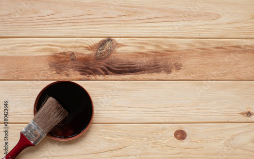 Wood texture and paintbrush, concept of home renovation.