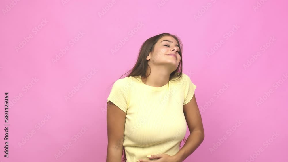 Young caucasian woman touches tummy, smiles gently, eating and satisfaction concept Young caucasian woman touches tummy, smiles gently, eating and satisfaction concept
