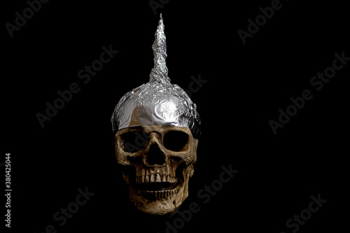 skull wearing a tinfoil hat isolated