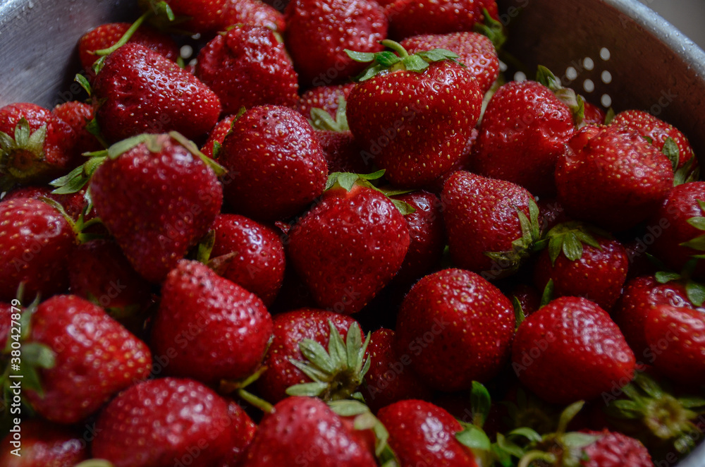 close up view of a pile of handpicked and freshly rinsed red strawberries close up view of a pile of handpicked and freshly rinsed red strawberries