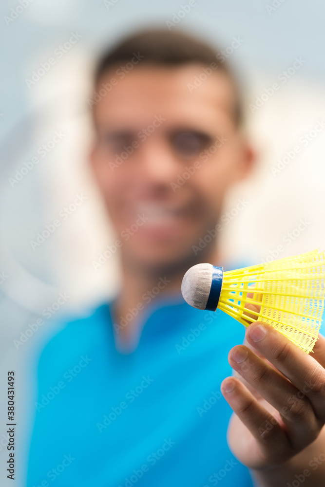 man showing a badminton shuttlecock Stock Photo Adobe Stock