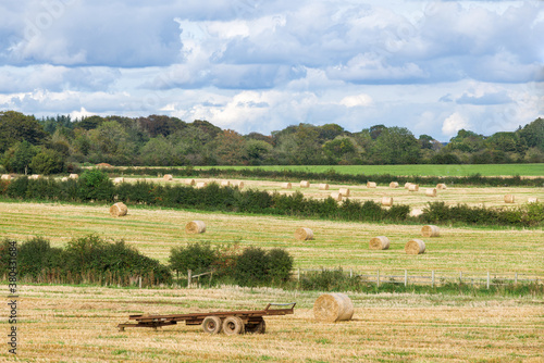 First Colours of Autumn over Scotland's Ayrshire Farmlands With Farmers Trailer and hay Bales at the Heart of Burns Country.