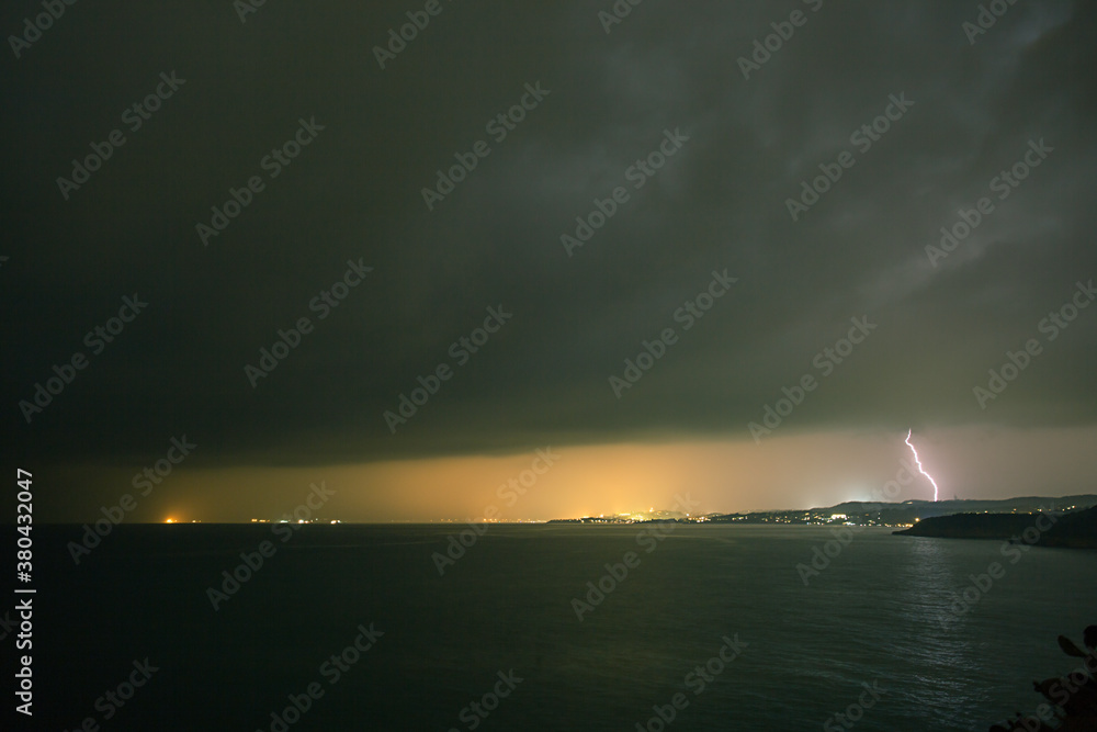 Powerful lightning during a storm at sea Powerful lightning during a storm at sea