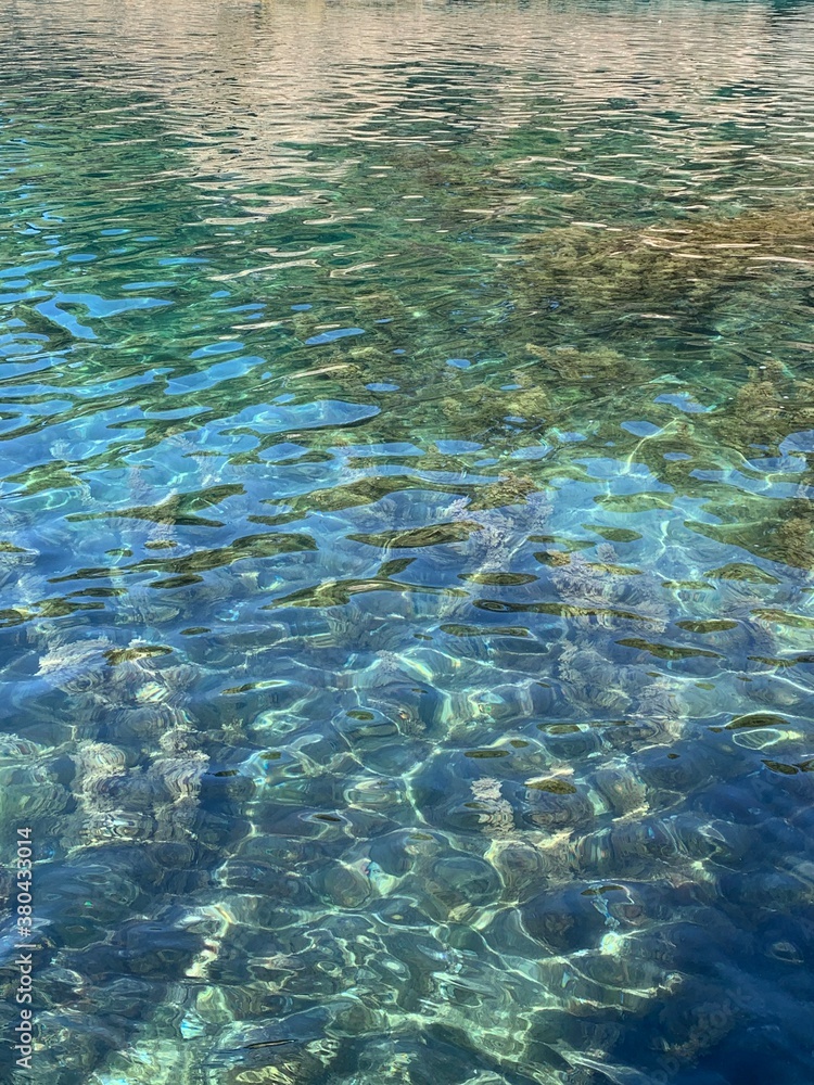 Fototapeta premium Crystal clear sea water surface. Turquoise calm Adriatic sea in Montenegro.