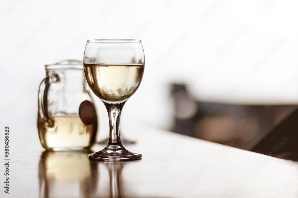 Glass and Carafe of White Wine Glass and Carafe of White Wine