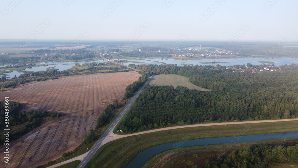 Top view of an asphalt road in the fields