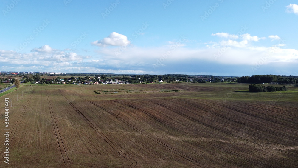 Fototapeta premium Top view of a large agricultural field. Landscape from above