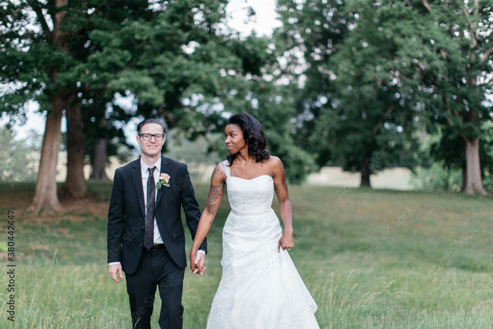 Portrait of an attractive interracial couple during their wedding Portrait of an attractive interracial couple during their wedding