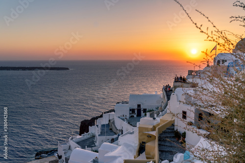 Beautiful panoramic view from Oia to caldera and volcano at sunset. Picturesque natural background with copy space for text. Santorini island, Cyclades, Greece, Europe. © mathilde