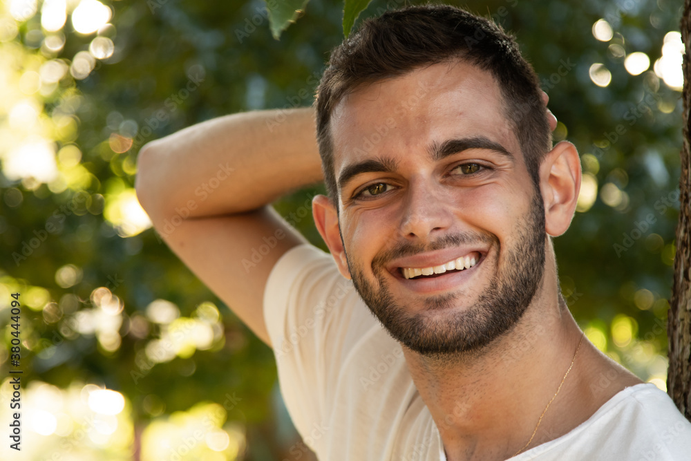 portrait of smiling young man with beard portrait of smiling young man with beard