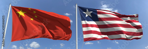 Flying flags of China and Liberia on high flagpoles. 3d rendering