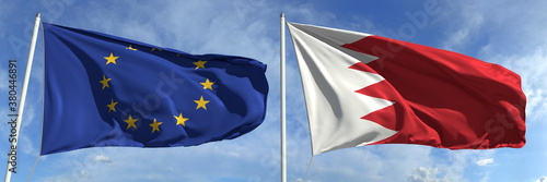 Flags of the European Union and Bahrain on flagpoles. 3d rendering