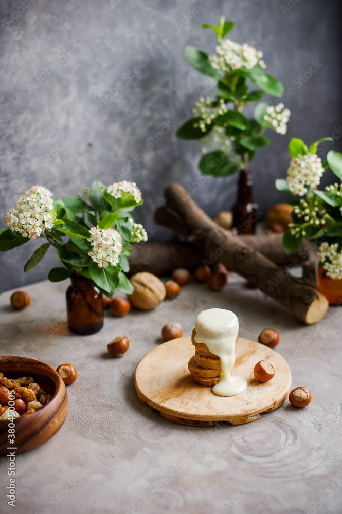 Fototapeta premium Still life with many jars of small white flowers. Scenery for subject shooting.