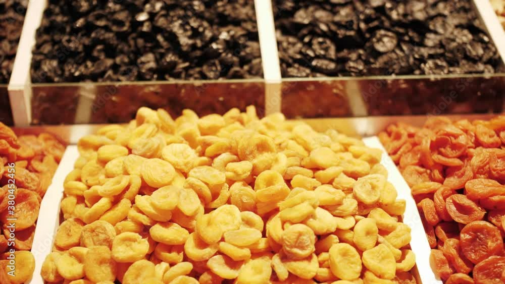 Market counter with various assorted dried fruits and nuts. Healthy food. Local market place. Market counter with various assorted dried fruits and nuts. Healthy food. Local market place.